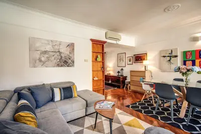 a living room with a couch and a table at FRESH HOUSE MONTI in Rome