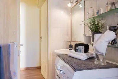a bathroom with a sink and a counter with towels at St. Joseph Apartment 47 in Rome