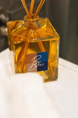 a glass jar with sticks in it on a table at B-STAY Via Milano 52 in Rome