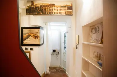 a hallway with a painting of a building on the wall at Il Rifugio di Trastevere in Rome