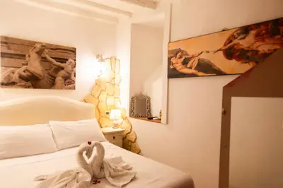 a bedroom with a bed with a stuffed animal on it at Il Rifugio di Trastevere in Rome