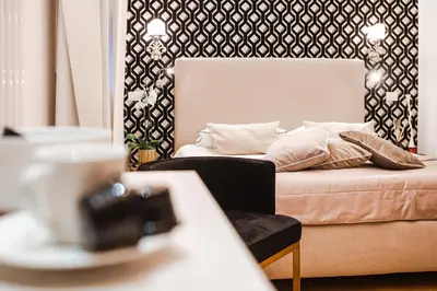 a bed with pillows on it in a room at EBL LUXURY HOME in Rome