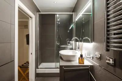 a bathroom with a sink and a shower at EBL LUXURY HOME in Rome