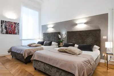 a bedroom with two beds in a room at EBL LUXURY HOME in Rome
