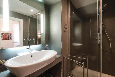 a bathroom with a sink and a shower at EBL LUXURY HOME in Rome