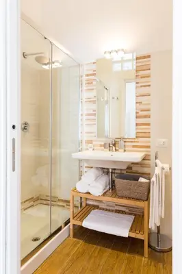 a bathroom with a sink and a shower at Rest Guesthouse in Rome