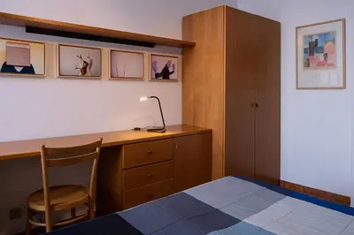 a bedroom with a desk and a bed and a chair at Appartamento 2 in centro a Roma in Rome