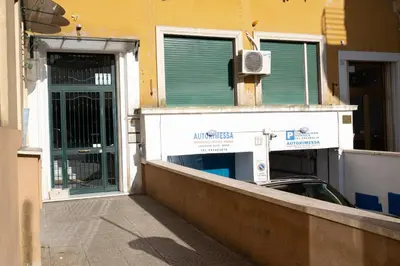 a building with two doors and a car parked outside at Appartamento 2 in centro a Roma in Rome