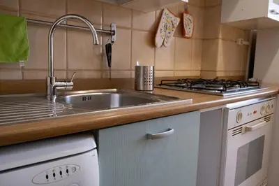 a kitchen with a sink and a stove at Appartamento 2 in centro a Roma in Rome