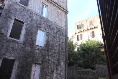 an old stone building with windows on the side of it at Lovely Navona Apartment in Rome