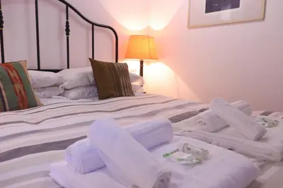 a bedroom with two beds with towels on them at Lovely Navona Apartment in Rome