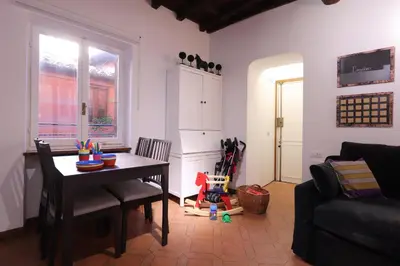 a living room with a table and a couch at Lovely Navona Apartment in Rome