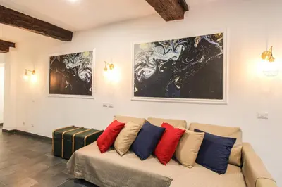 a living room with a couch with pillows on it at Charming Large Apartment - 3 Bedroom in Trastevere in Rome