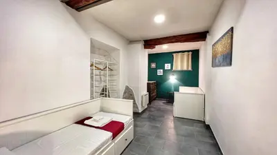 a room with a bath tub and a bathroom at Charming Large Apartment - 3 Bedroom in Trastevere in Rome