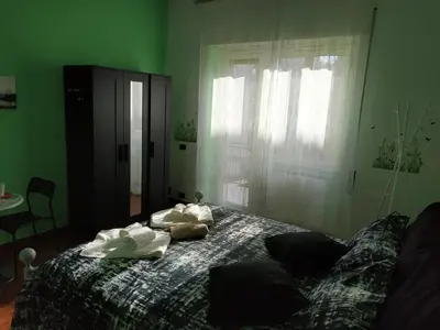 a bedroom with a bed with towels on it at B&B Claudia a Monteverde in Rome