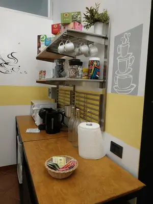 a kitchen with a wooden counter top with a counter top at B&B Claudia a Monteverde in Rome
