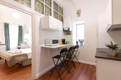 a small kitchen with a table and chairs in a room at Leonardo Suite Pantheon in Rome