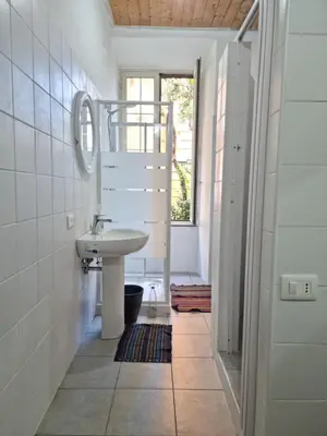 a bathroom with a sink and a mirror at SUNSHINE HOSTEL in Rome