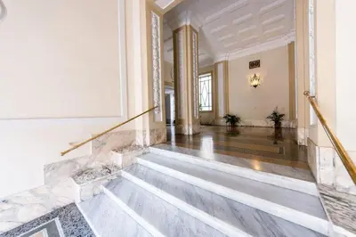 an empty room with a staircase in a building at SUNSHINE HOSTEL in Rome
