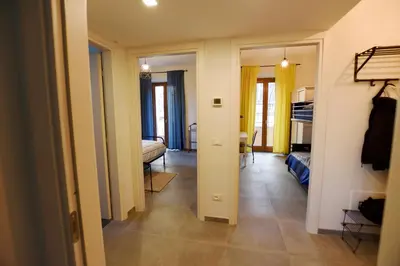 a hallway with a living room and a bedroom at La casetta di Anastasia in Rome