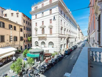 a city street with buildings and parked motorcycles at Apartment Antico Balcone by Interhome in Rome