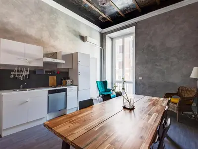 a kitchen with a wooden table in a room at Apartment Antico Balcone by Interhome in Rome