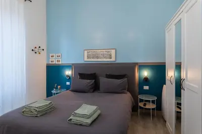 a bedroom with a bed with two towels on it at A Casa Lamperini 59 in Rome