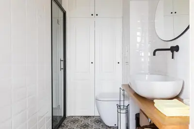 a white bathroom with a sink and a toilet at Celestina House - VATICAN in Rome