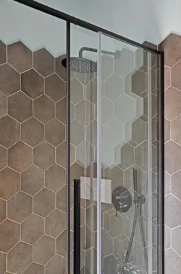 a shower with a glass door in a bathroom at Colosseo Apartment 23 in Rome