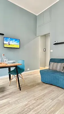 a living room with a table and a couch at Colosseo Apartment 23 in Rome