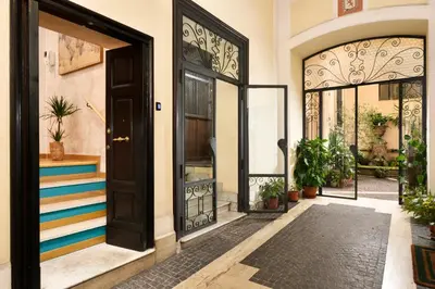 an entrance to a house with a door with colorful stripes at Piazza del Popolo Boutique Home in Rome