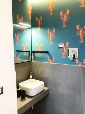 a bathroom with a sink and a toilet in it at Ottaviano Smart Rooms in Rome