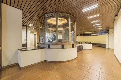 a lobby with a counter in a building at GuestHost - Sant'Angelo Modern Apartment in Rome