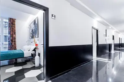 a room with a bed and a large sliding door at V-Accommodation IV Fontane in Rome