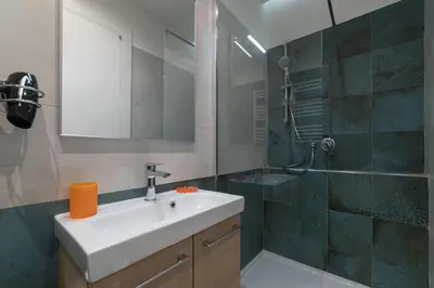 a bathroom with a sink and a shower at Roman Station House in Rome