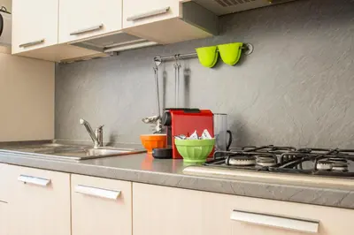 a kitchen counter with a sink and a stove at RELAIS CAVOUR 133 in Rome