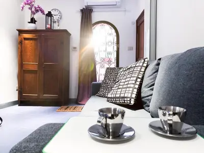 a living room with a couch and a table at Romantico appartamento a Trastevere in Rome