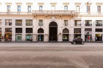 a small car parked in front of a building at Deluxe Suite Welness in Rome