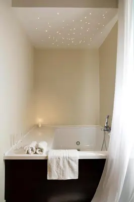 a bedroom with a tub and a bed and a window at Roman Holidays Boutique in Rome