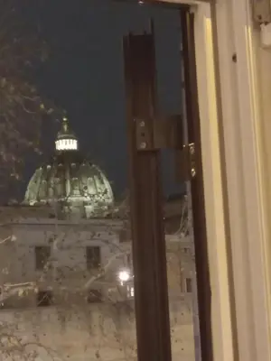a view of the capitol building at night from a window at Stefano House Vaticano Roma in Rome