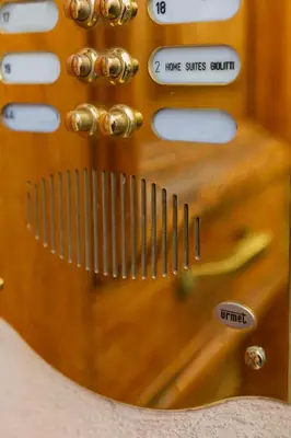 a close up of a wooden guitar instrument at Home Suites Giolitti in Rome