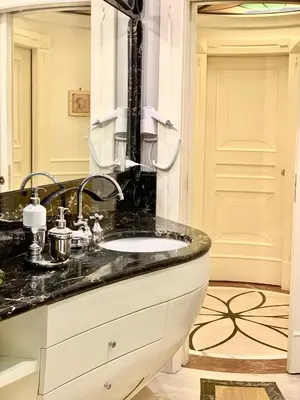 a bathroom with a sink and a mirror at Simon's Guest House Rome in Rome