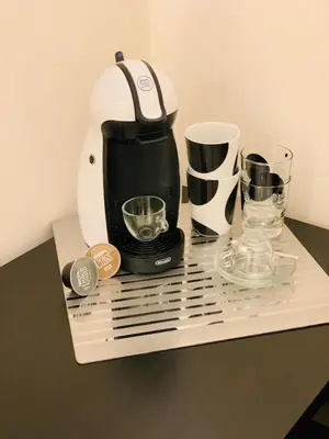 a coffee maker sitting on top of a table at Simon's Guest House Rome in Rome