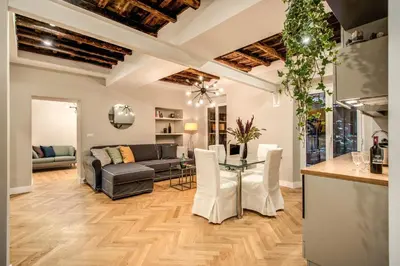 a living room with a couch and a table at Trevi Fountain Superior 3 bdr apartment in Rome