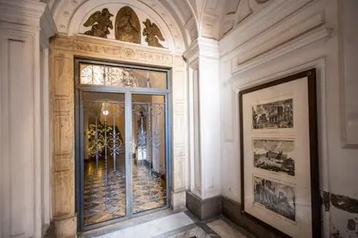a hallway with a glass door in a building at Trevi Fountain Superior 3 bdr apartment in Rome