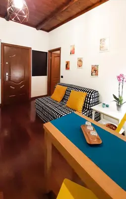 a living room with a couch and a table at Casa Flavia - Beauty apartment close to Vatican Museum in Rome