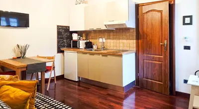 a kitchen with a sink and a counter top at Casa Flavia - Beauty apartment close to Vatican Museum in Rome