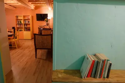 a group of books sitting on the floor in a room at Rome old town luxury loft in Rome