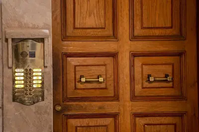 a wooden door with a telephone on it at Residenza Nobile Laurina in Rome