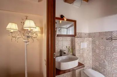 a bathroom with a sink and a mirror at Residenza Nobile Laurina in Rome